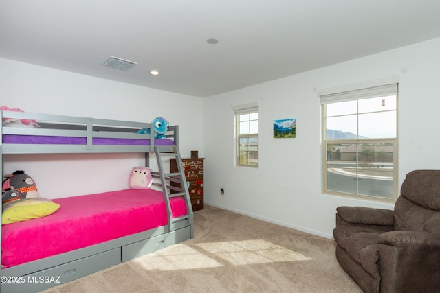 bedroom featuring light carpet