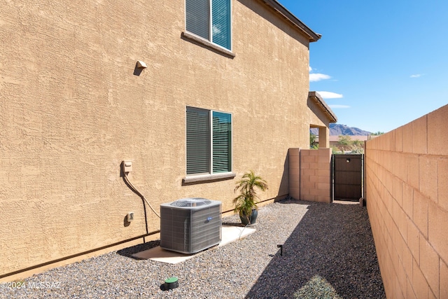 view of home's exterior with central AC unit