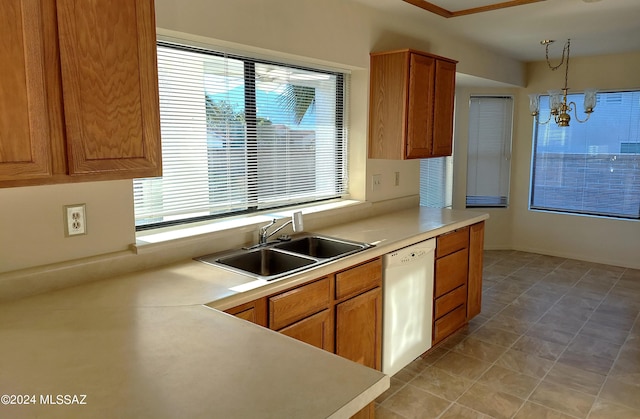 kitchen featuring an inviting chandelier, dishwasher, decorative light fixtures, and sink