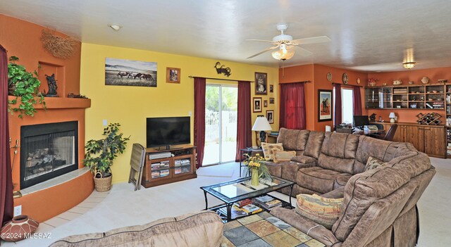 living room with ceiling fan and light carpet