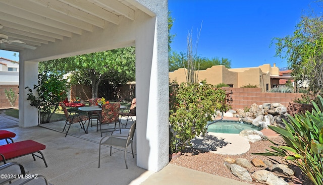 view of patio with ceiling fan