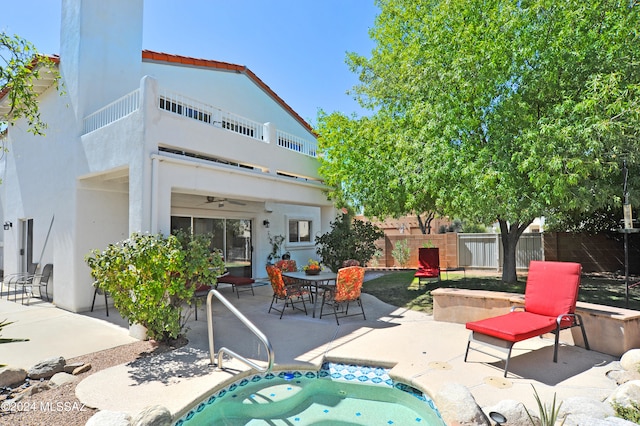 view of pool with a patio and ceiling fan