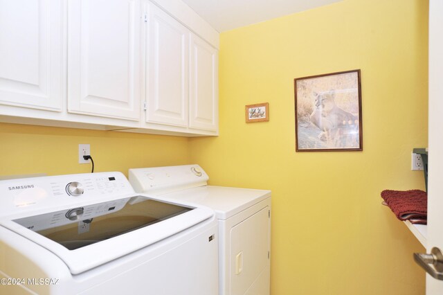 laundry area with cabinets and separate washer and dryer