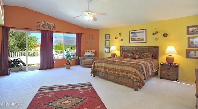 carpeted bedroom with ceiling fan, vaulted ceiling, and access to outside