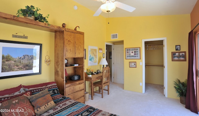 carpeted bedroom featuring a spacious closet, vaulted ceiling, a closet, and ceiling fan