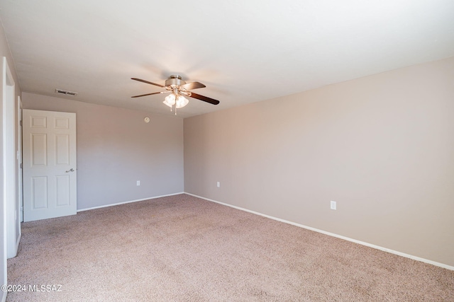 unfurnished room with ceiling fan, baseboards, visible vents, and light colored carpet