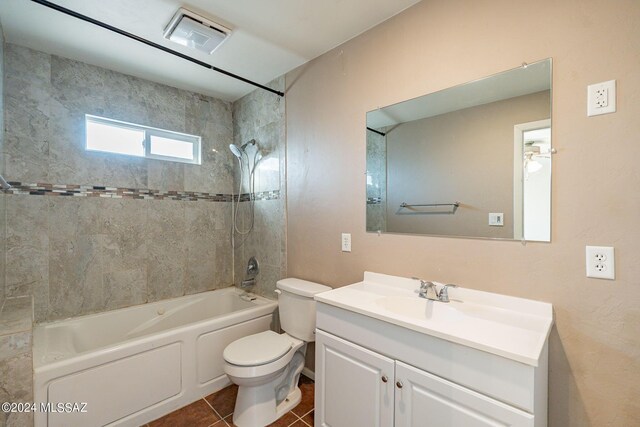 bathroom featuring visible vents, toilet, bathtub / shower combination, vanity, and tile patterned flooring