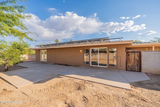 back of property featuring a patio, french doors, and fence