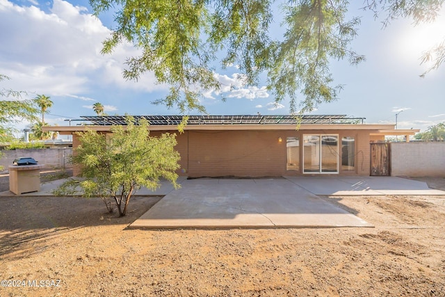 back of house with a patio area and fence