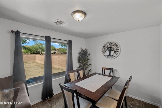 398 W Cedar Chase Dr, Green Valley, AZ 85614 - dining room featuring visible vents, baseboards, and dark tile patterned flooring
