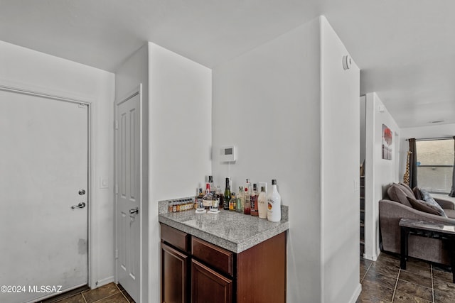 398 W Cedar Chase Dr, Green Valley, AZ 85614 - bar with baseboards and a dry bar