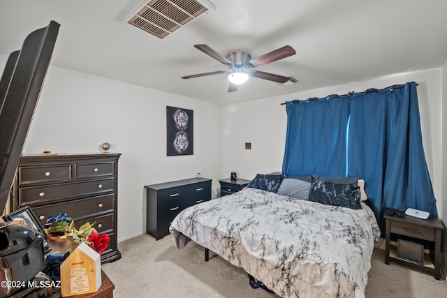 398 W Cedar Chase Dr, Green Valley, AZ 85614 - bedroom with visible vents, baseboards, a ceiling fan, and light colored carpet