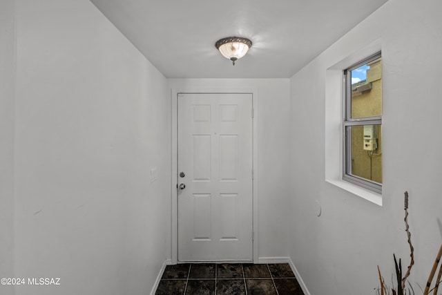 398 W Cedar Chase Dr, Green Valley, AZ 85614 - doorway to outside featuring baseboards
