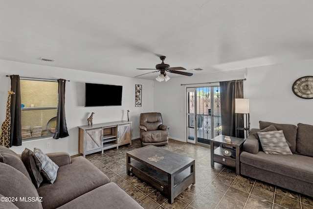 398 W Cedar Chase Dr, Green Valley, AZ 85614 - living room with a ceiling fan, visible vents, and tile patterned flooring
