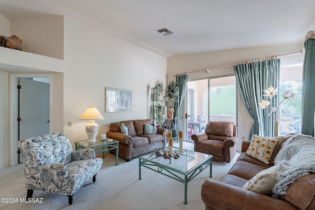 living room featuring vaulted ceiling and light colored carpet