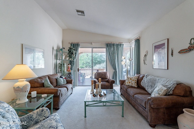 living room with lofted ceiling and light carpet