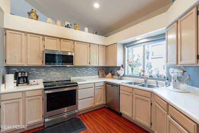 kitchen featuring light brown cabinetry, appliances with stainless steel finishes, and sink