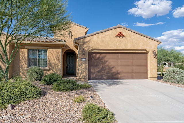 view of front of property with a garage