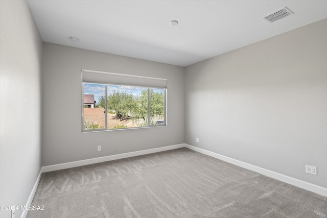 unfurnished room featuring carpet