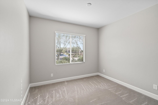 unfurnished room with carpet floors