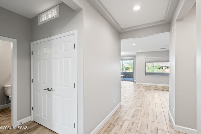 corridor featuring light hardwood / wood-style floors