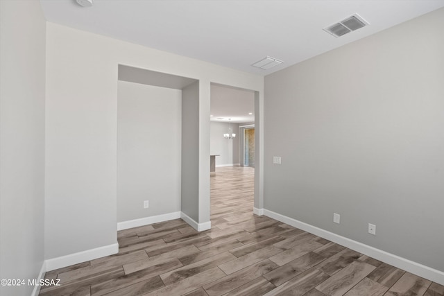 unfurnished room with light hardwood / wood-style flooring