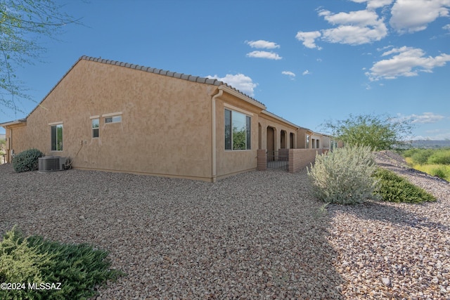 view of property exterior with central air condition unit