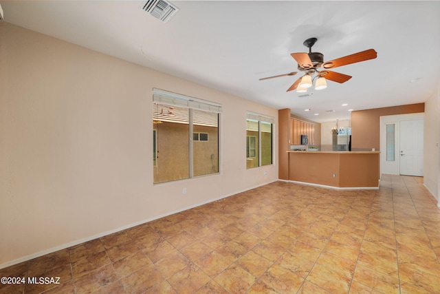 interior space with ceiling fan