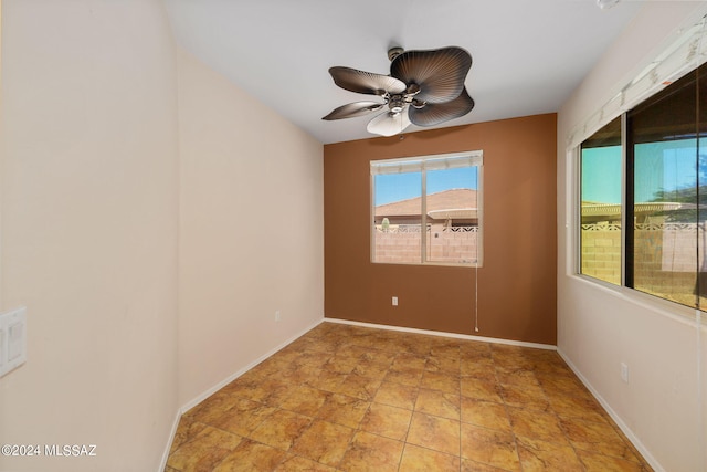 unfurnished room featuring ceiling fan