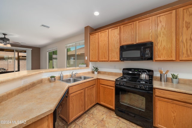 kitchen with black appliances, ceiling fan, and sink