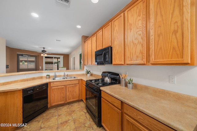 kitchen featuring black appliances, kitchen peninsula, sink, and ceiling fan