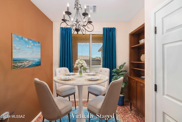 dining space with a chandelier