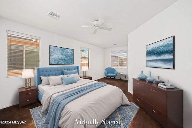 bedroom with dark wood-type flooring and ceiling fan