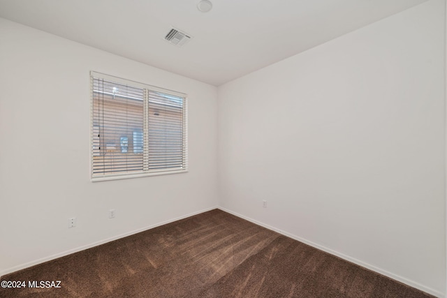 empty room featuring carpet floors