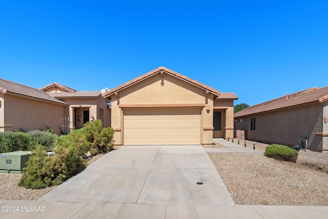 ranch-style house featuring a garage