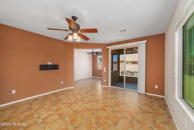 unfurnished room featuring ceiling fan