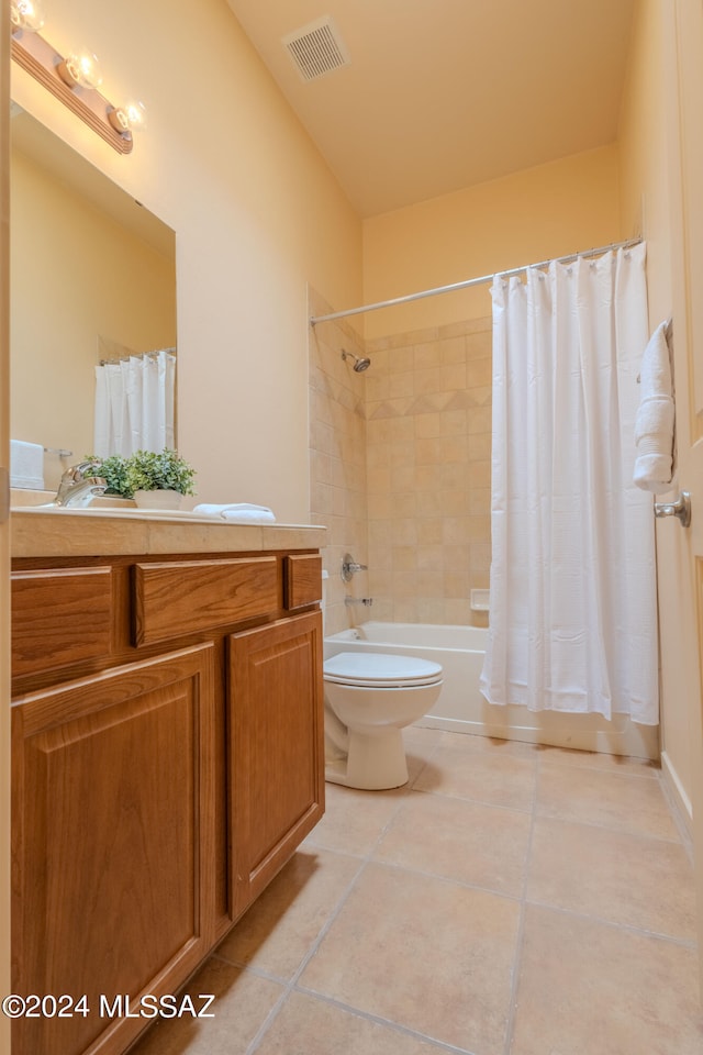 full bathroom featuring shower / bath combination with curtain, tile patterned floors, vanity, and toilet