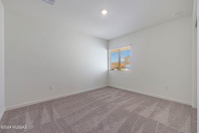 unfurnished room with carpet floors