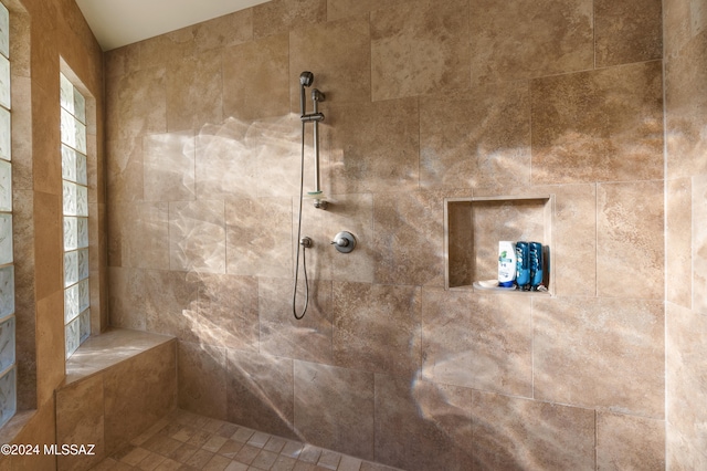 bathroom with a tile shower