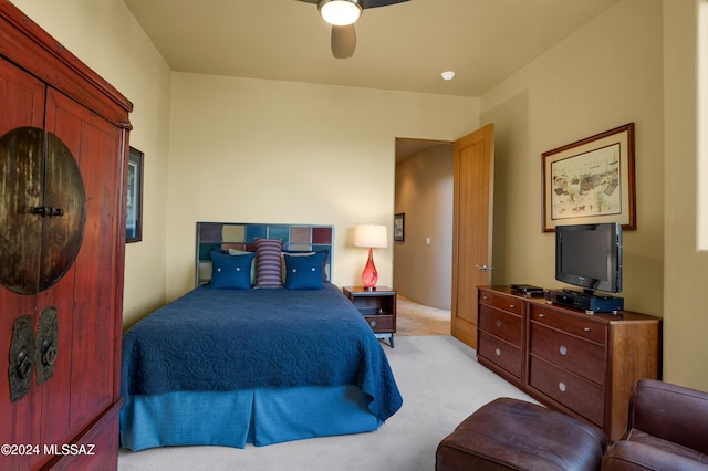 bedroom with ceiling fan and light colored carpet