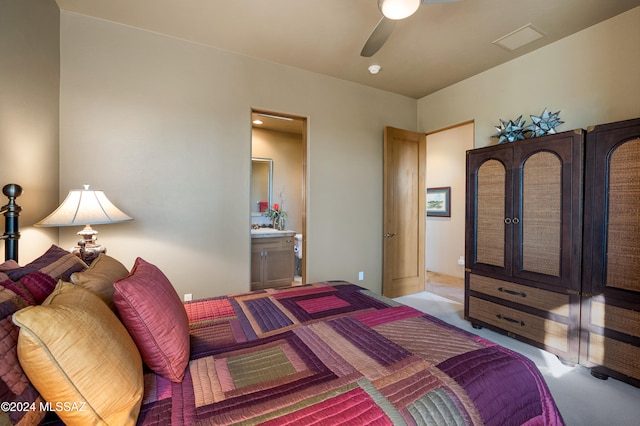 bedroom with ceiling fan and connected bathroom