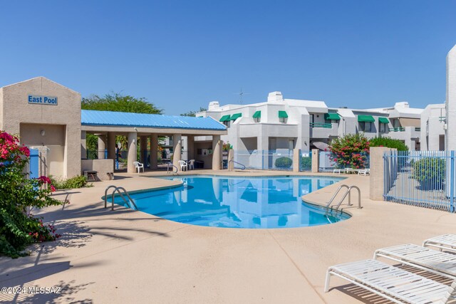 view of swimming pool with a patio