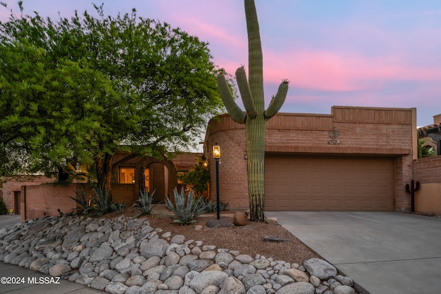 view of front of property with a garage