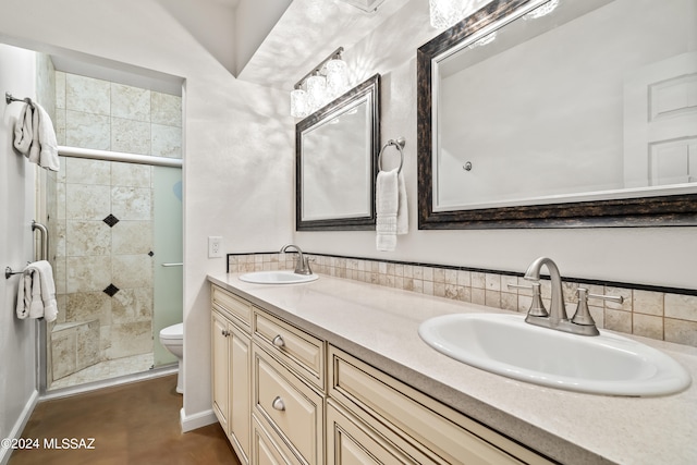 bathroom with vanity, toilet, and a shower with door