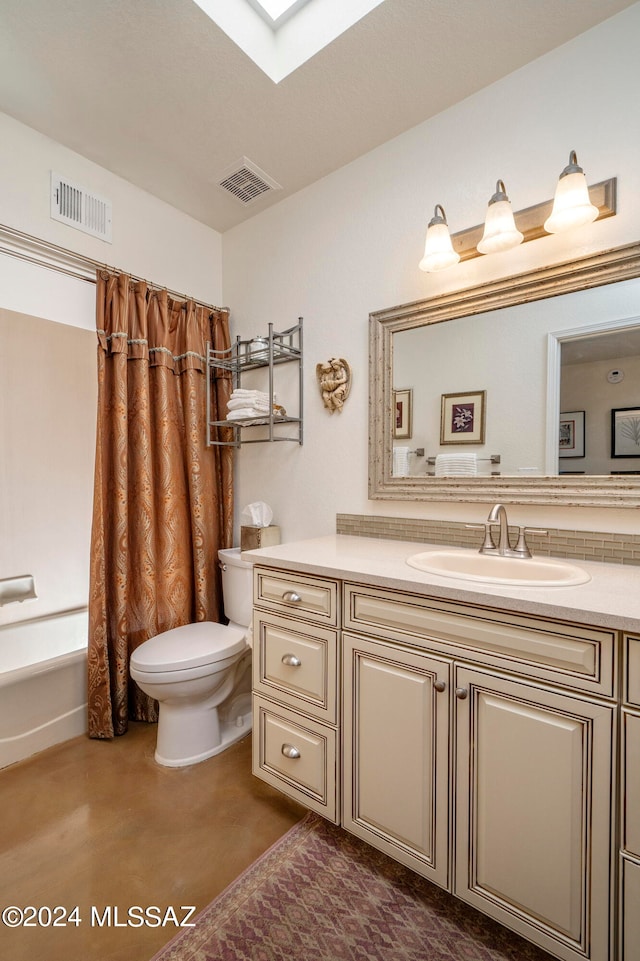 full bathroom with concrete floors, toilet, a skylight, vanity, and shower / tub combo with curtain