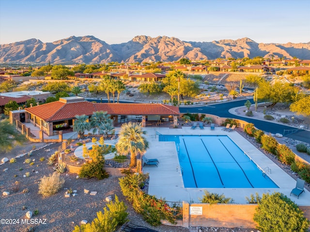 view of pool with a mountain view and a patio area