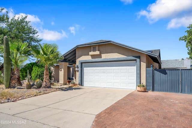 single story home with a garage