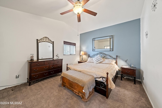 bedroom featuring ceiling fan, vaulted ceiling, and carpet