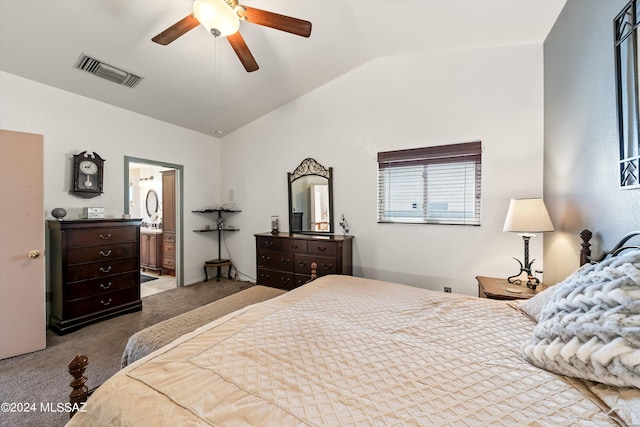 carpeted bedroom with connected bathroom, vaulted ceiling, and ceiling fan