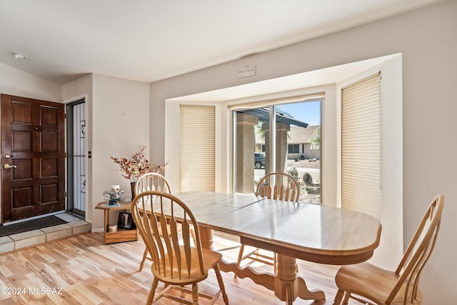 dining area with light hardwood / wood-style floors